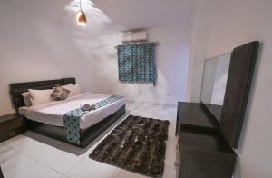 Postel nebo postele na pokoji v ubytování Pyramids Gem Plaza Hotel