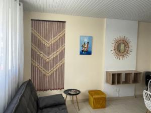 Posezení v ubytování Cosy T3 au coeur de Sainte Anne