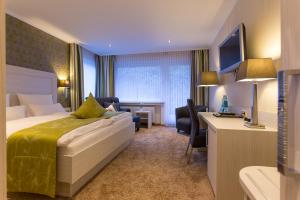 Postel nebo postele na pokoji v ubytování Hotel Garni Fürst von Waldeck
