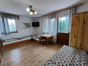 Postel nebo postele na pokoji v ubytování Kompleks Wypoczynkowy Harnaś II