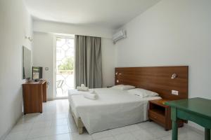 Posteľ alebo postele v izbe v ubytovaní Olympia Sun Hotel