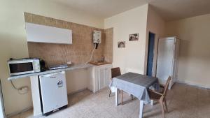 Kuchyň nebo kuchyňský kout v ubytování Calma Maison de charme
