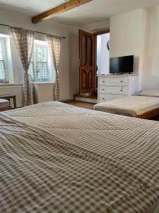 Posteľ alebo postele v izbe v ubytovaní Apartmán U Kapličky