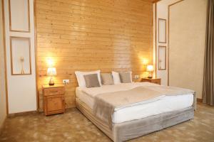 Postel nebo postele na pokoji v ubytování BMG Hotel by Grigoryans Group