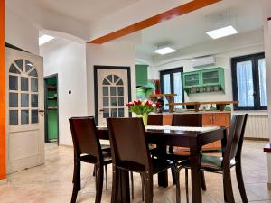 a dining room with a table and chairs at Seamply apartment il mare in 1 minuto in Maiori +17 photos