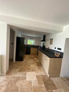 Kuchyň nebo kuchyňský kout v ubytování Maison du bonheur