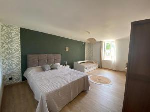 Postel nebo postele na pokoji v ubytování Maison du bonheur