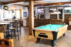 a pool table in the middle of a restaurant at Whistler's Inn in Jasper