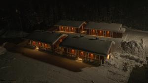 Marsfjäll Mountain Lodge Stugor i Saxnäs v zimě