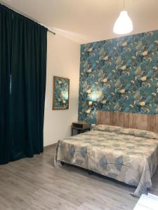 Postel nebo postele na pokoji v ubytování Hotel Ai Tufi