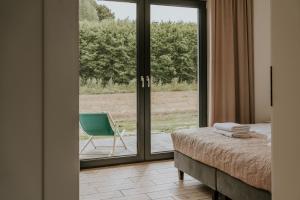 Postel nebo postele na pokoji v ubytování Apartamenty u Cherubinów