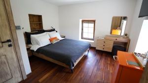 a bedroom with a bed and a dresser at Muyo House in Urla +37 photos