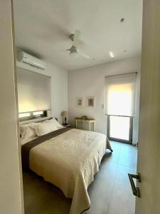 A bed or beds in a room at Villa Isabella Aegina Még 30 kép