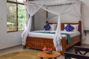 Postel nebo postele na pokoji v ubytování Zanzibar View Hotel