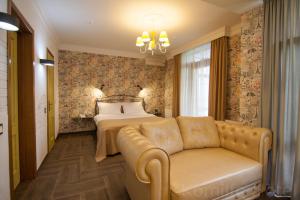 Voodi või voodid majutusasutuse Komilfo Hotel toas