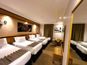 Postel nebo postele na pokoji v ubytování Maysan Al Maqam Hotel + 37 fotografií