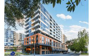 a rendering of a tall building with glass windows at Sydney Private Home in Bankstown