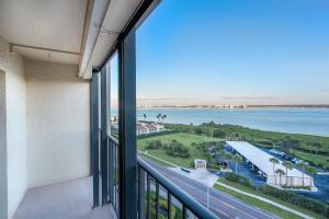 a view of the water from a balcony of a building at Sand Key South Beach Condo #910 in Clearwater Beach
