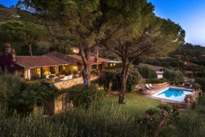 an aerial view of a house with a swimming pool at Porto Ercole Exclusive Villa in Porto Ercole +33 photos