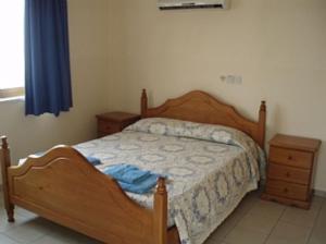 Postel nebo postele na pokoji v ubytování Coral Blue Villa + 14 fotografií