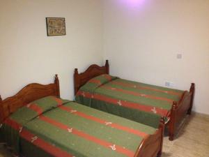 Postel nebo postele na pokoji v ubytování Coral Blue Villa