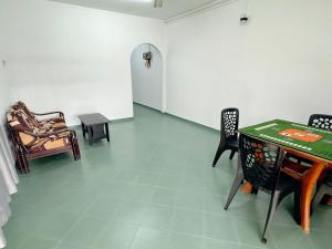a room with chairs and a table in a room at 390 Kurau in Kuala Kurau +5 photos