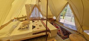 a bedroom with a bed in a tent at Delta Sunrise in Somova