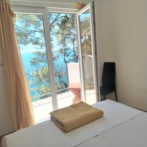 Ένα ή περισσότερα κρεβάτια σε δωμάτιο στο Apartman L&M