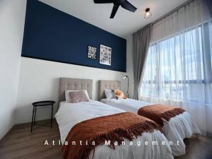 a bedroom with two beds and a large window at Sungai Besi, Uno Promenade, Nearby Bukit Jalil & Salak Selatan MRT by Atlantis Management in Kuala Lumpur +11 photos