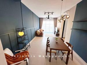 a living room with a table and a dining room at Sungai Besi, Uno Promenade, Nearby Bukit Jalil & Salak Selatan MRT by Atlantis Management in Kuala Lumpur