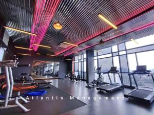 a gym with several treadmills and exercise bikes at Sungai Besi, Uno Promenade, Nearby Bukit Jalil & Salak Selatan MRT by Atlantis Management in Kuala Lumpur