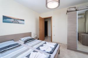Postel nebo postele na pokoji v ubytování Apolon Complex