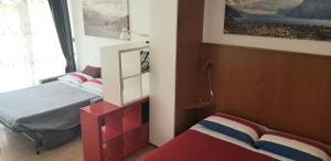 Postel nebo postele na pokoji v ubytování Lake Garda Bike&Hike Apartment