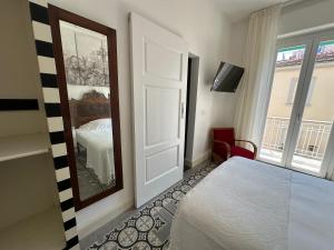 Postel nebo postele na pokoji v ubytování Domus Socolatae Cocoa Journey Tuscan Lifestyle B&B