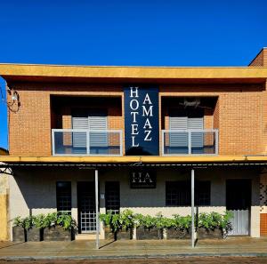 a building with a sign on the side of it at HOTEL AMAZ in Ribeirão Preto
