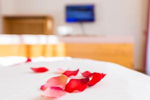 Postel nebo postele na pokoji v ubytování Hotel Goldene Rose