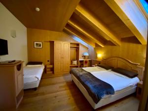 Postel nebo postele na pokoji v ubytování Hotel Pedranzini