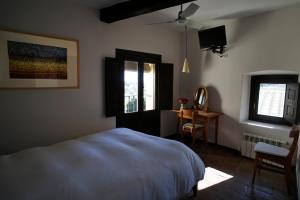 Postel nebo postele na pokoji v ubytování Casa Rural Hosteria Cantarranas
