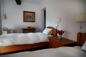 Postel nebo postele na pokoji v ubytování Casa Rural Hosteria Cantarranas