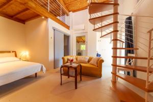 a bedroom with a bed and a spiral staircase at Florence Villa Violetta in Bagno a Ripoli