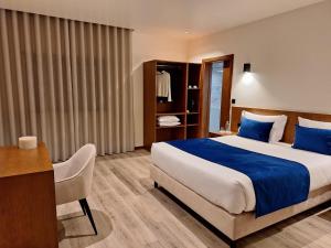 Postel nebo postele na pokoji v ubytování 3M Hostel & Suites