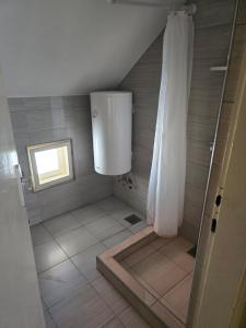 Koupelna v ubytování Kovačević apartman + 4 fotografie