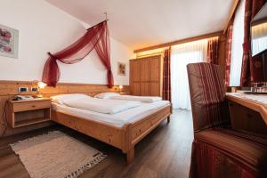 Postel nebo postele na pokoji v ubytování Hotel Goldene Rose + 37 fotografií
