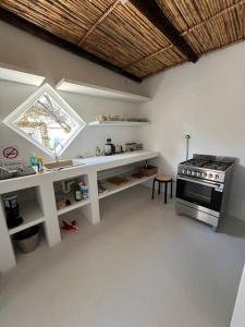 a kitchen with a sink and a stove at Stay at Molly in Prince Albert