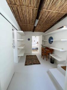 a room with white walls and a wooden ceiling at Stay at Molly in Prince Albert