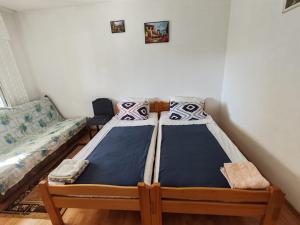 Postel nebo postele na pokoji v ubytování Apartmani Vodice