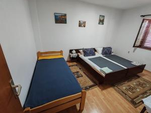 Postel nebo postele na pokoji v ubytování Apartmani Vodice