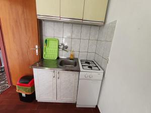 Kuchyň nebo kuchyňský kout v ubytování Apartmani Vodice