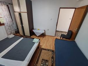 Postel nebo postele na pokoji v ubytování Apartmani Vodice