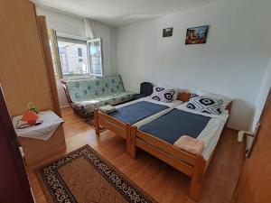 Postel nebo postele na pokoji v ubytování Apartmani Vodice